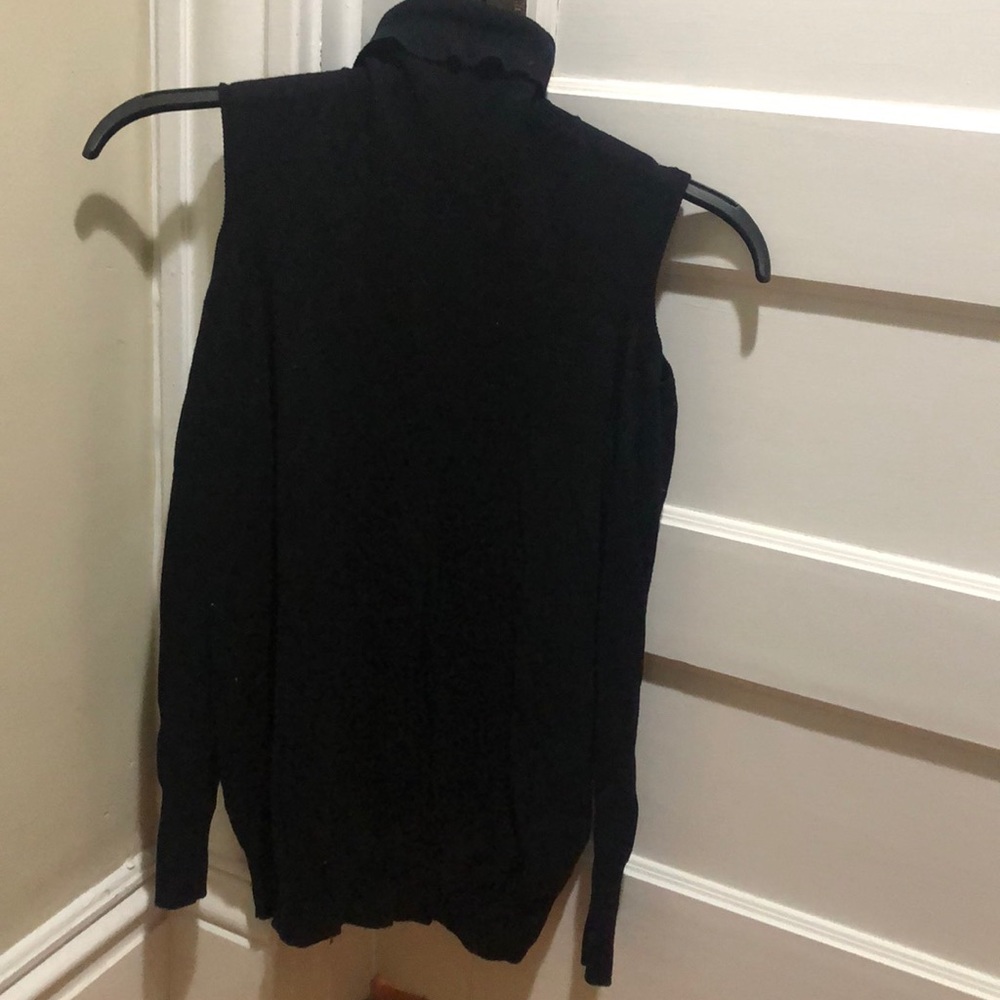 Open shoulder black turtleneck sweater